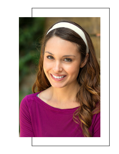 The image features a young woman with long hair smiling at the camera against a blurred background, likely taken for a portrait or profile picture.